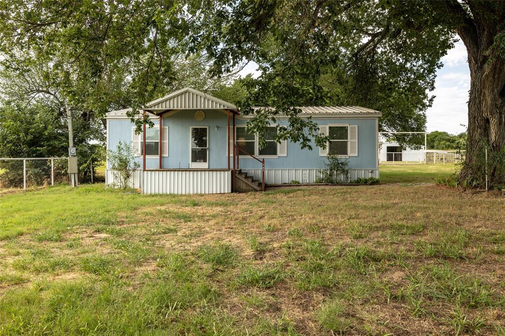 207 Lazy B Lane Springtown, TX 76082 - Photo 2 of 39 View of front of home with a front yard