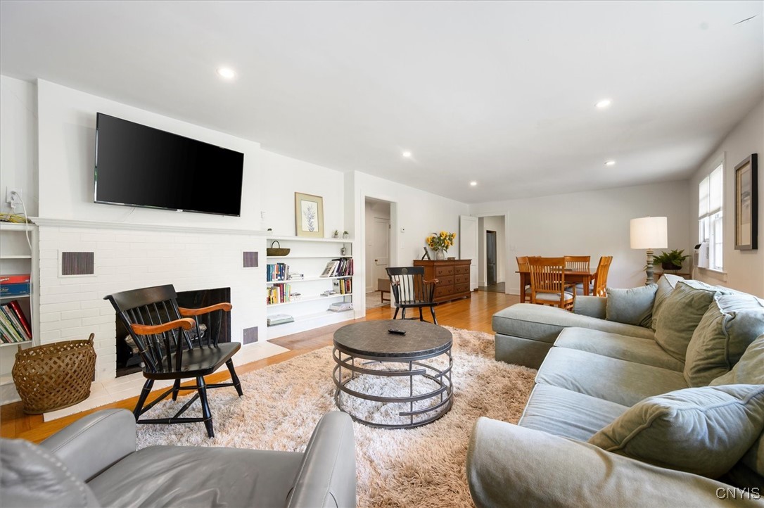 53 Payne Street Hamilton, NY 13346 - Photo 9 of 45 LR w/fireplace, bookshelves and nice hardwoods -