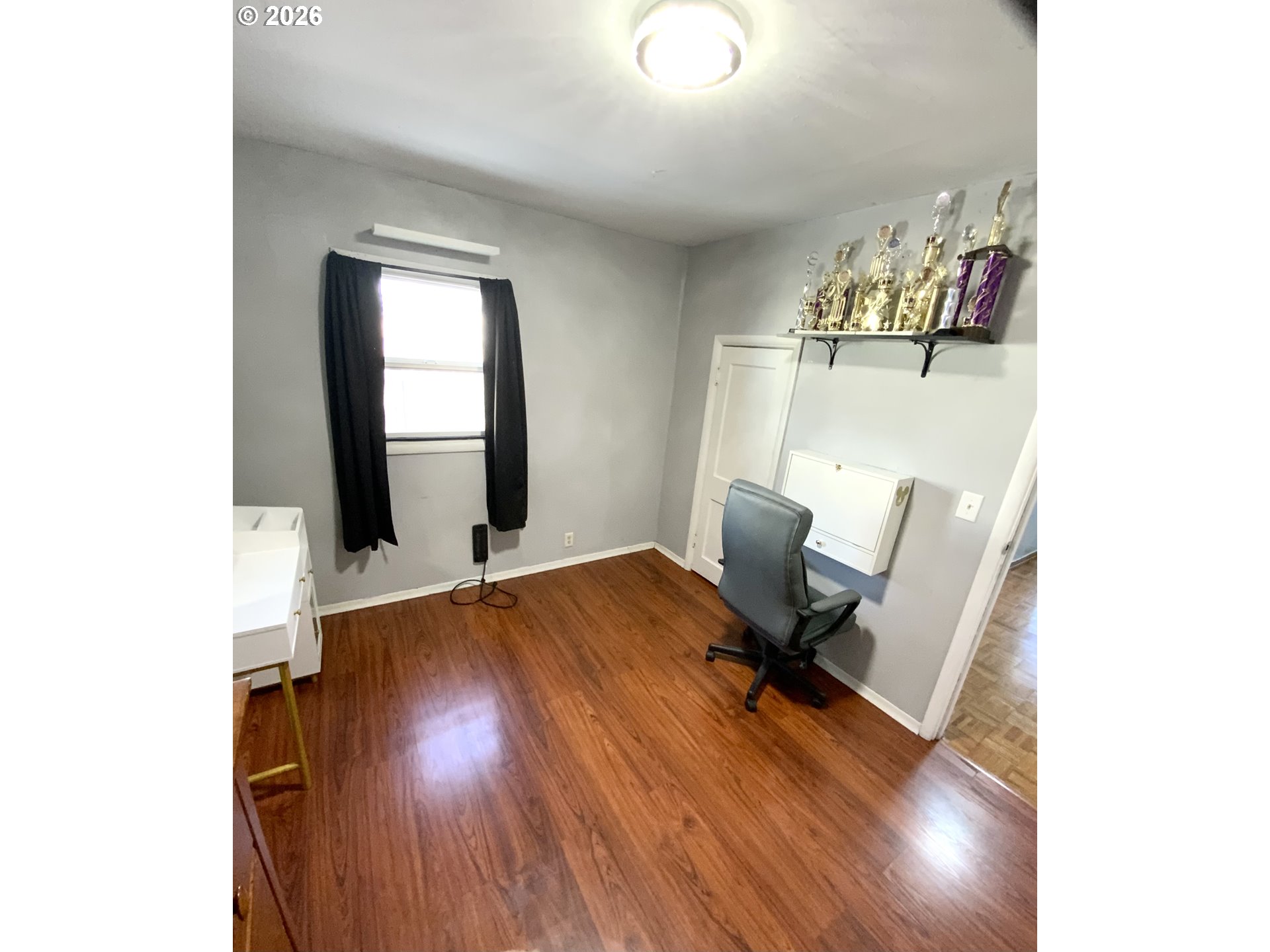 400 West 6th Street The Dalles, OR 97058 - Photo 13 of 28 a view of a room with wooden floor and furniture