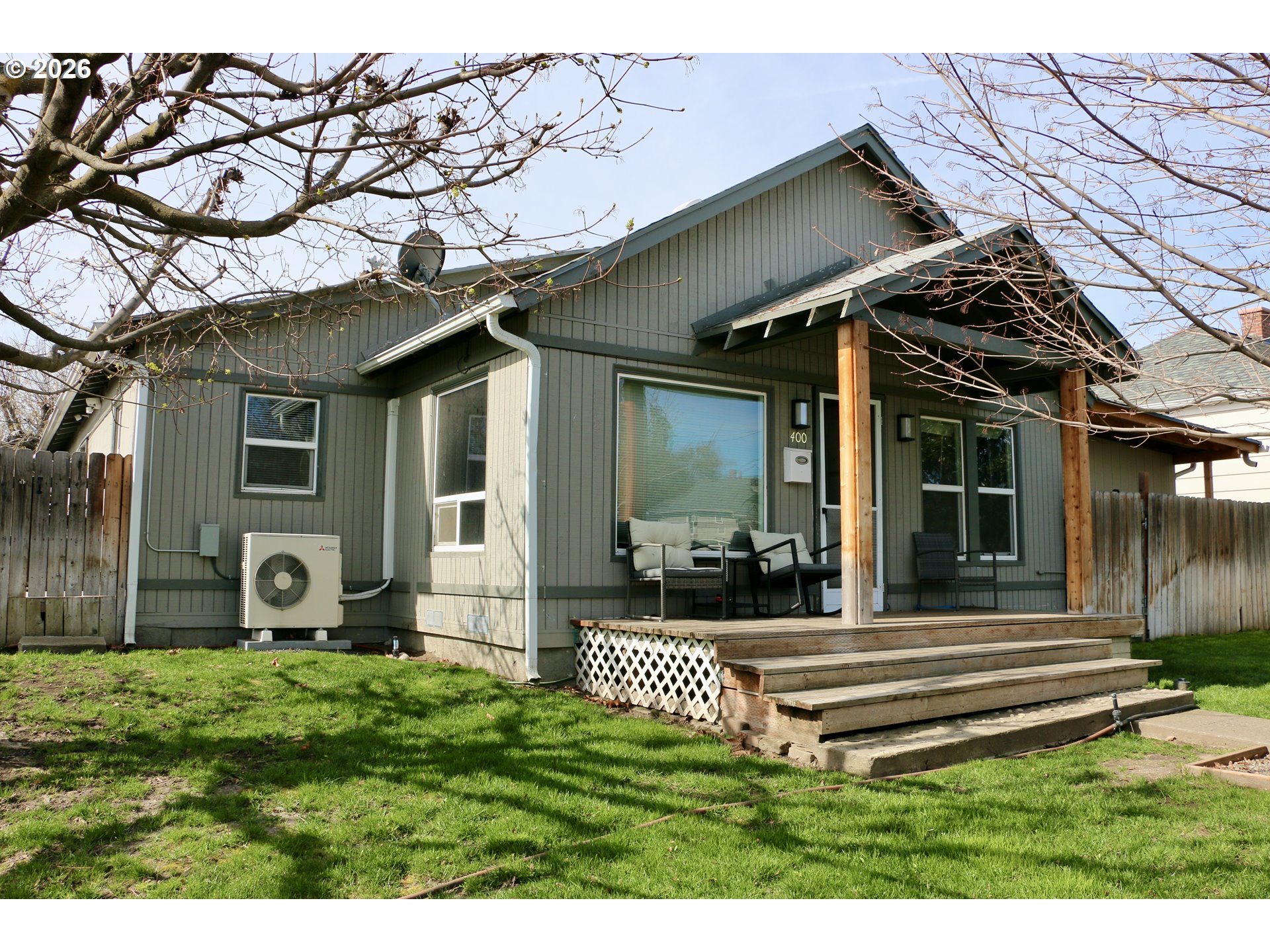 400 West 6th Street The Dalles, OR 97058 - Photo 2 of 28 a front view of a house with a yard