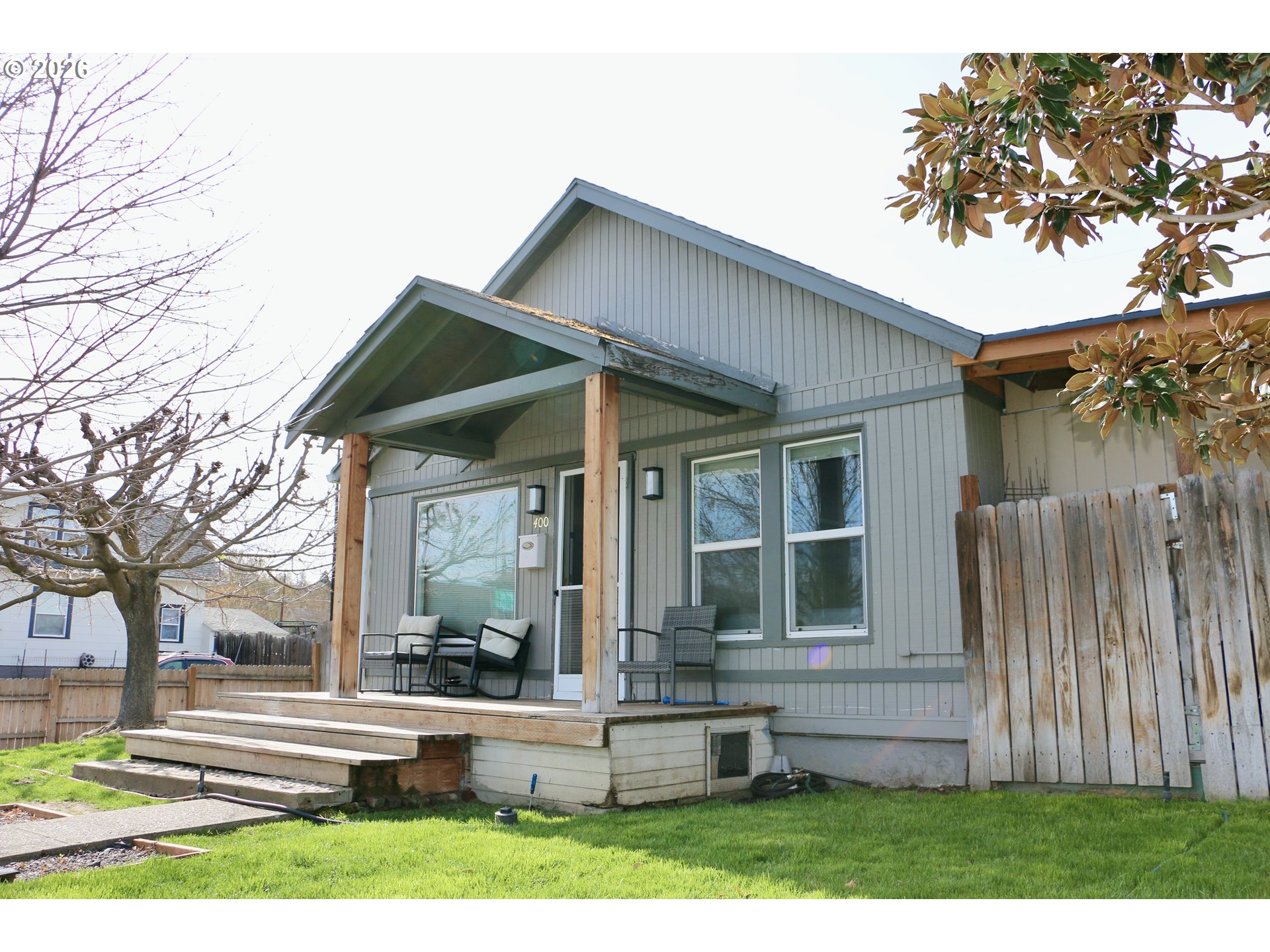 400 West 6th Street The Dalles, OR 97058 - Photo 3 of 28 front view of a house with a yard