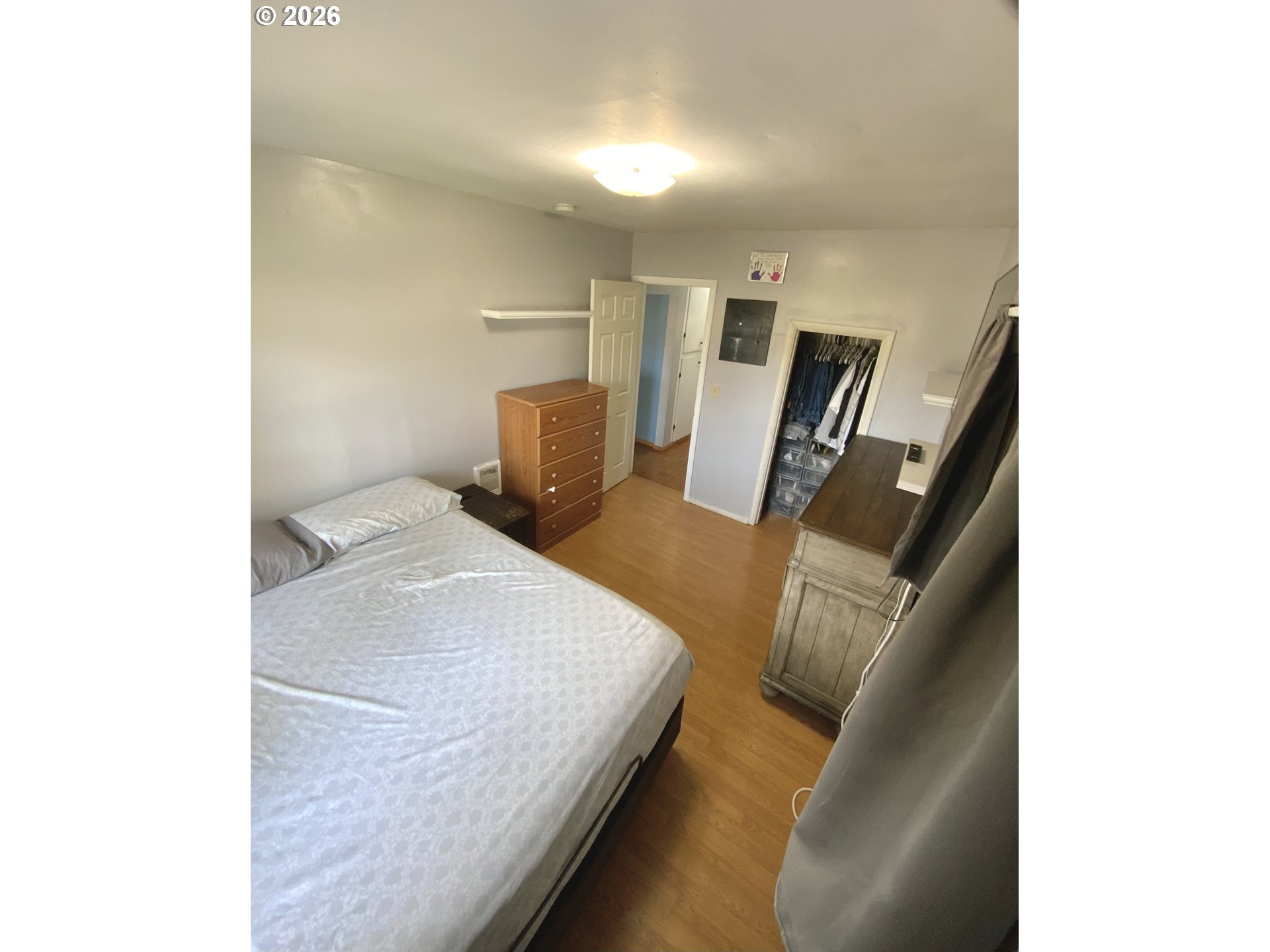 400 West 6th Street The Dalles, OR 97058 - Photo 8 of 28 a bedroom with a bed and furniture