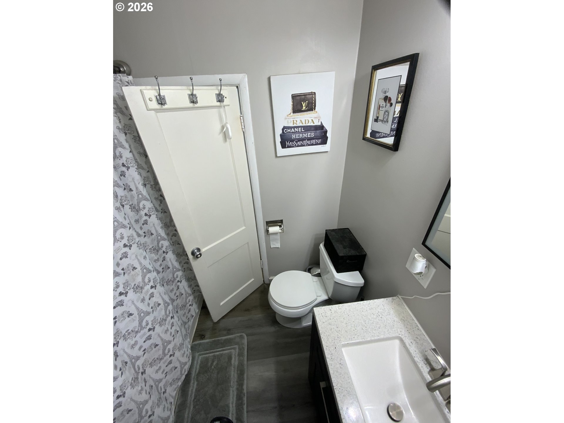 400 West 6th Street The Dalles, OR 97058 - Photo 10 of 28 a bathroom with a toilet and a mirror