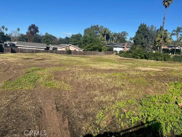 a view of a lake with houses in the background