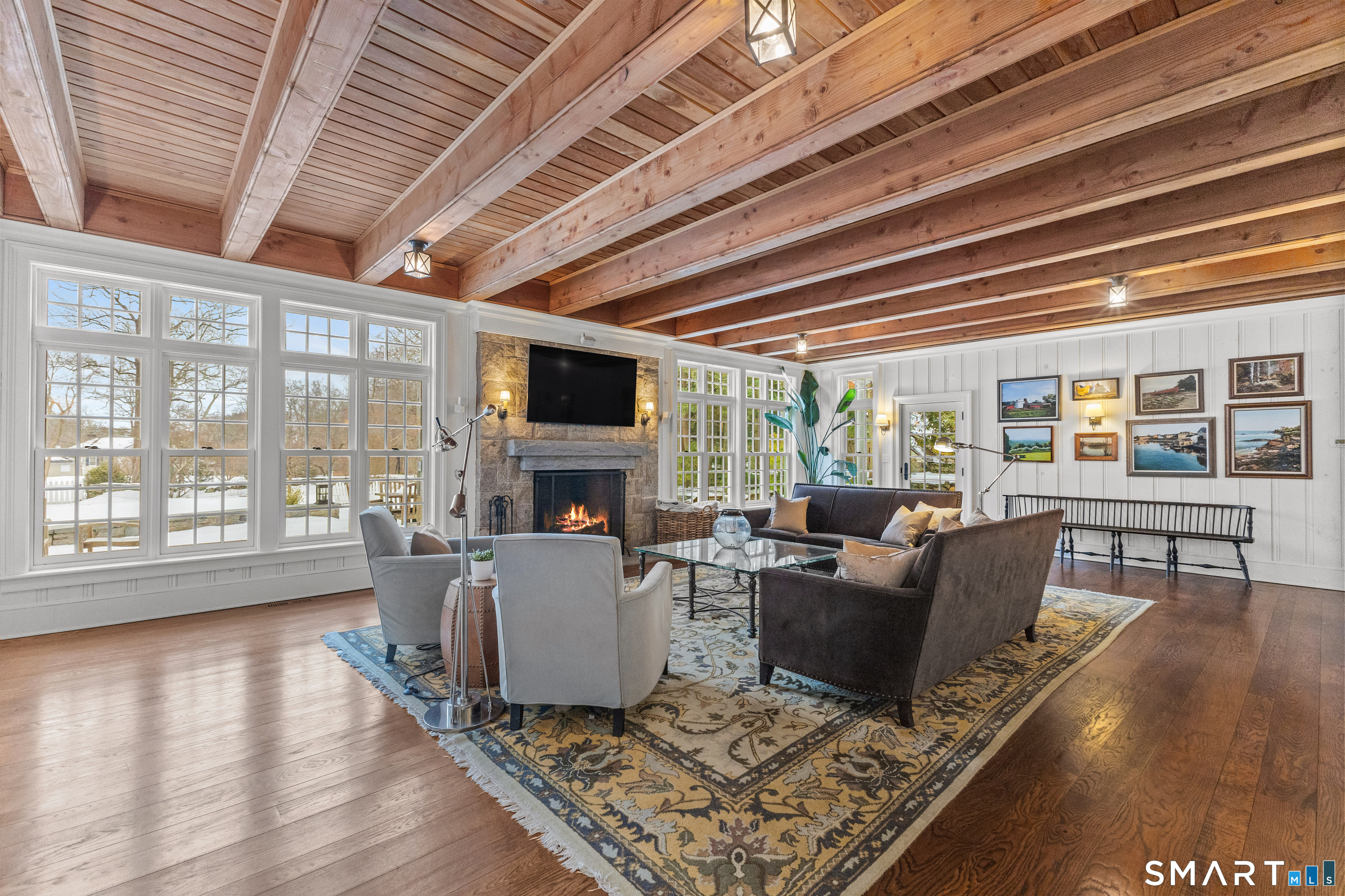 422 Scofieldtown Road Stamford, CT 06903 - Photo 11 of 38 a living room with furniture a fireplace and wooden floor