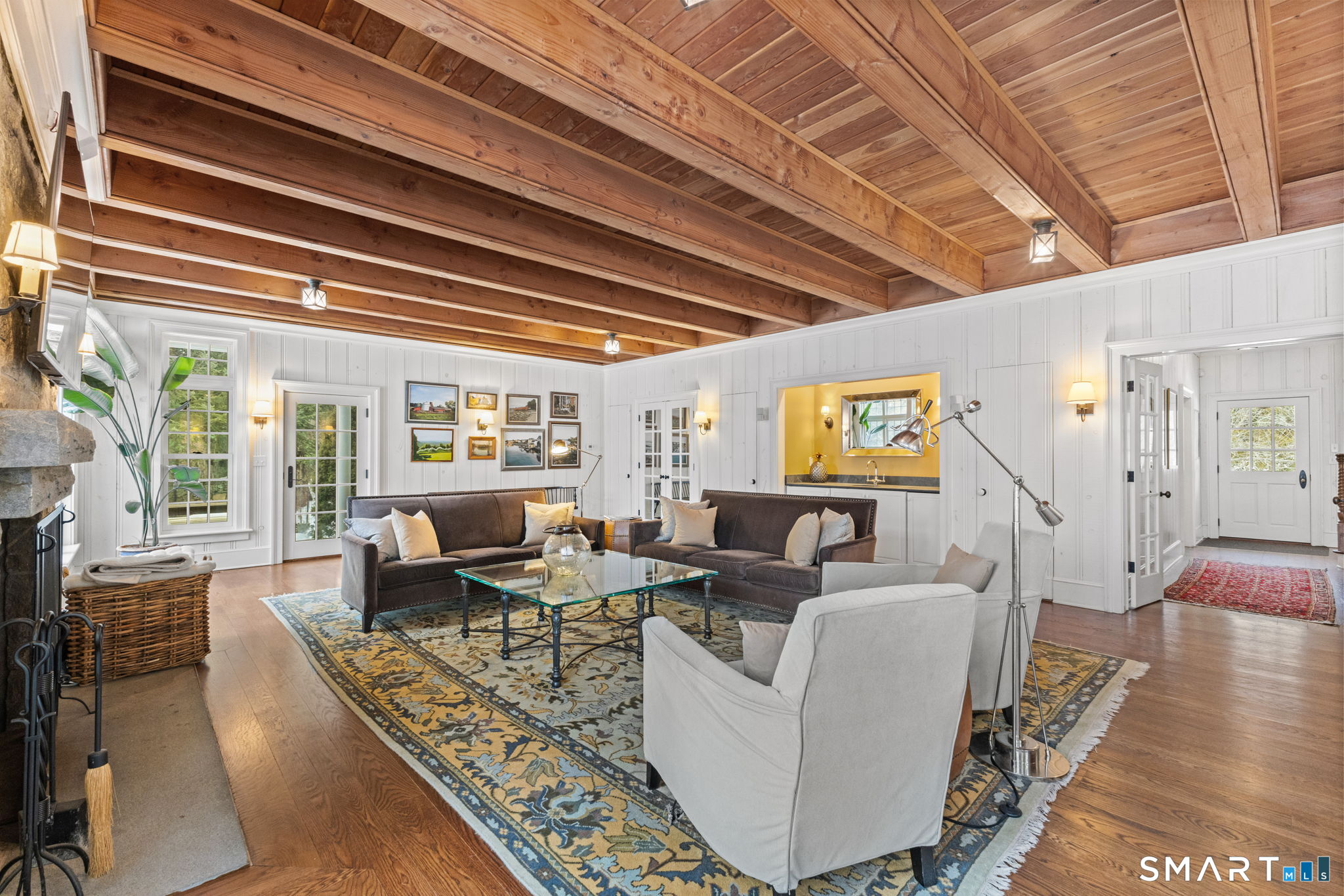422 Scofieldtown Road Stamford, CT 06903 - Photo 13 of 38 a living room with fireplace furniture and a wooden floor