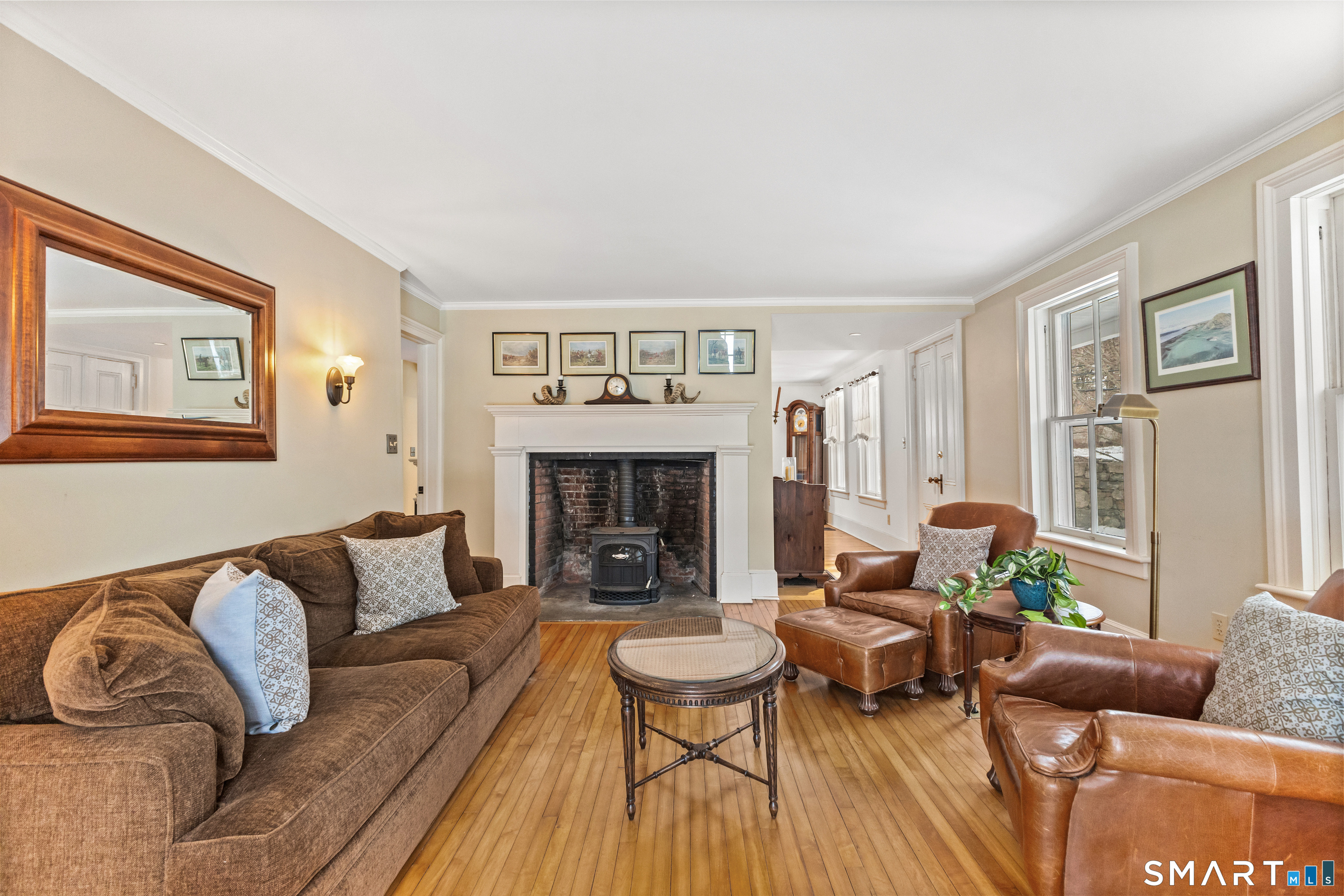 422 Scofieldtown Road Stamford, CT 06903 - Photo 19 of 38 a living room with furniture and a fireplace