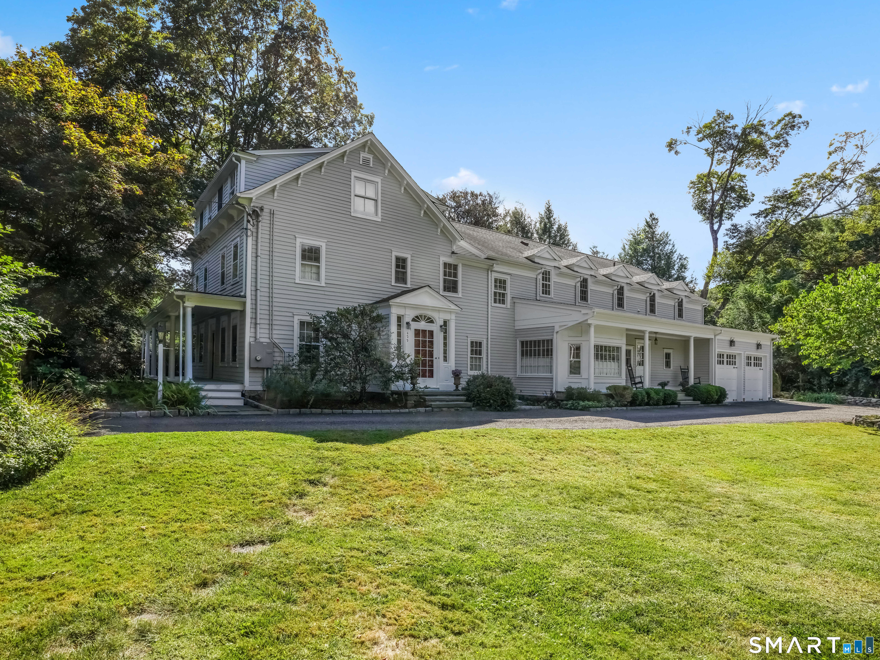422 Scofieldtown Road Stamford, CT 06903 - Photo 2 of 38 a front view of house with yard and trees in the background