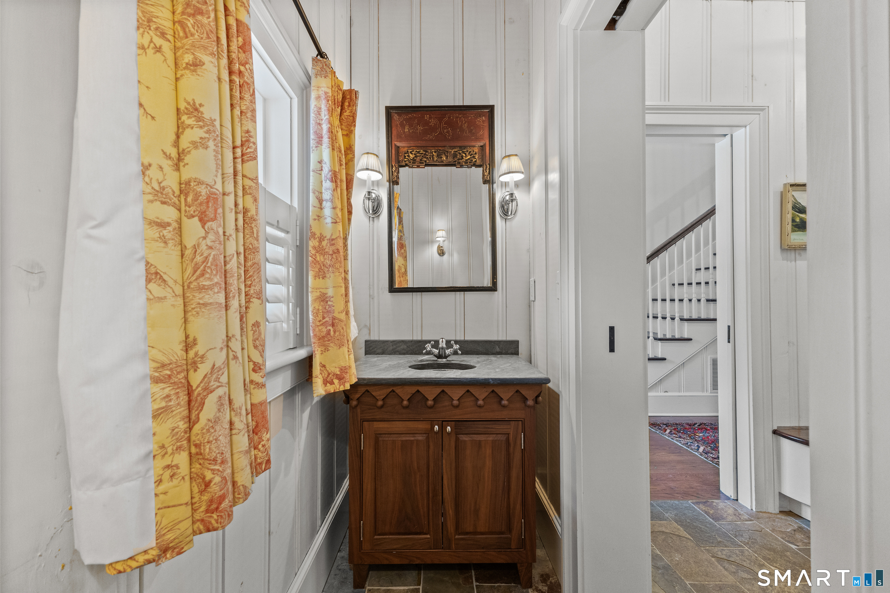 422 Scofieldtown Road Stamford, CT 06903 - Photo 21 of 38 a bathroom with a sink and a mirror