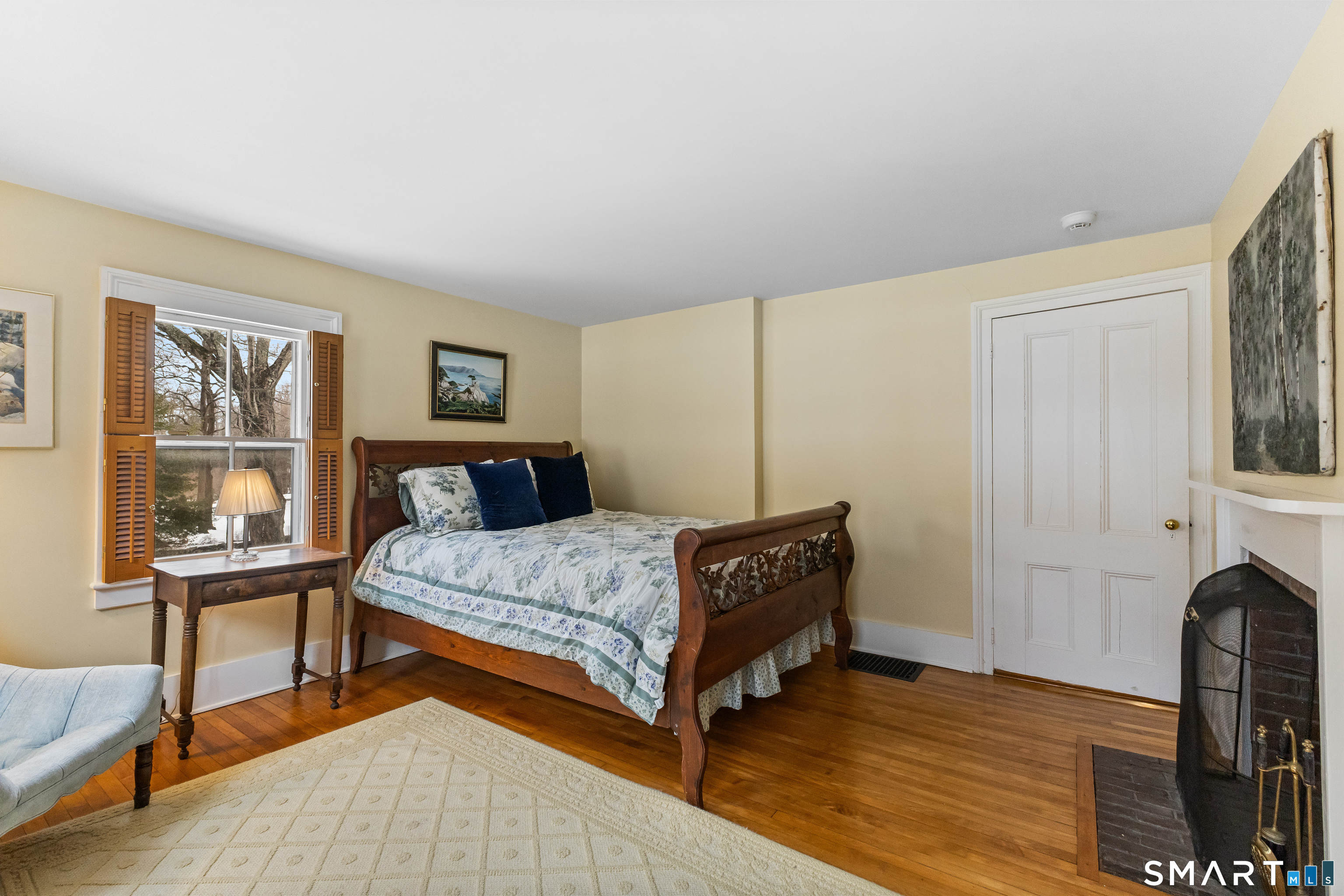 422 Scofieldtown Road Stamford, CT 06903 - Photo 27 of 38 a bedroom with a bed and wooden floor