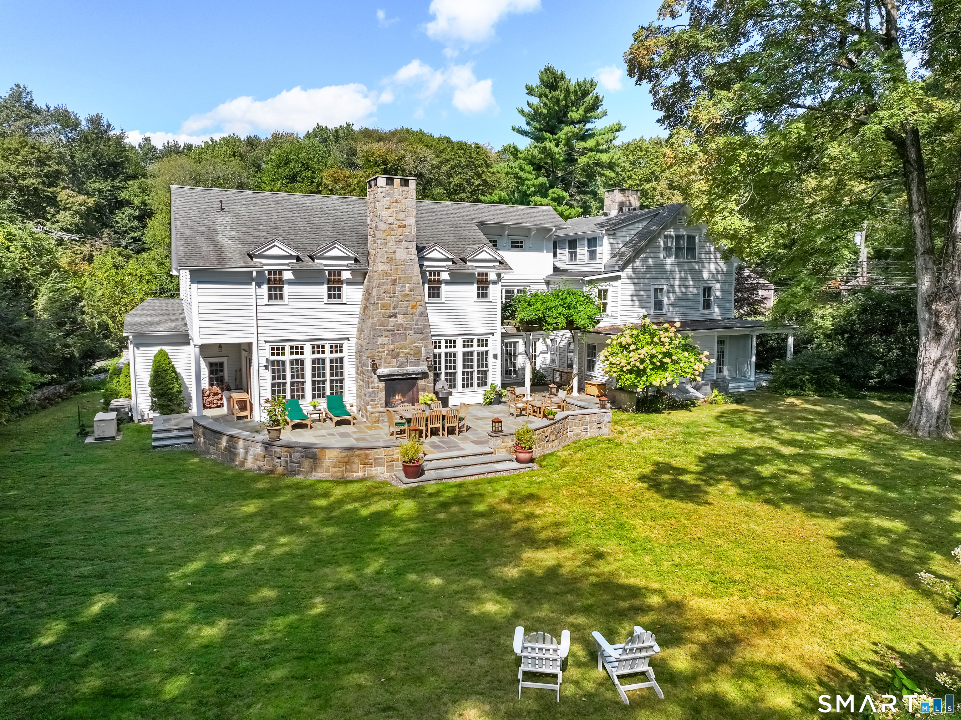 422 Scofieldtown Road Stamford, CT 06903 - Photo 31 of 38 a view of a house with a yard porch and sitting area
