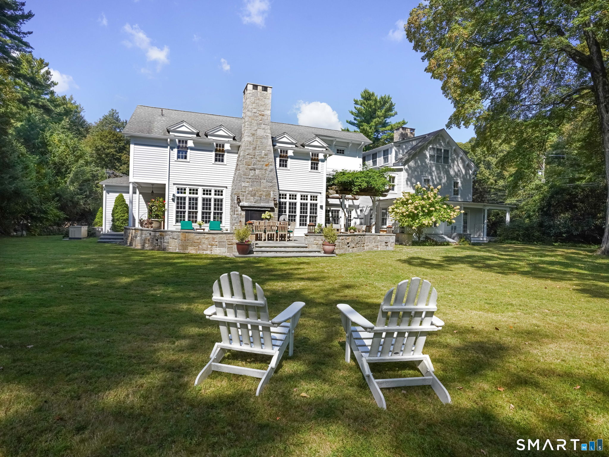 422 Scofieldtown Road Stamford, CT 06903 - Photo 33 of 38 a swimming pool with outdoor seating and yard
