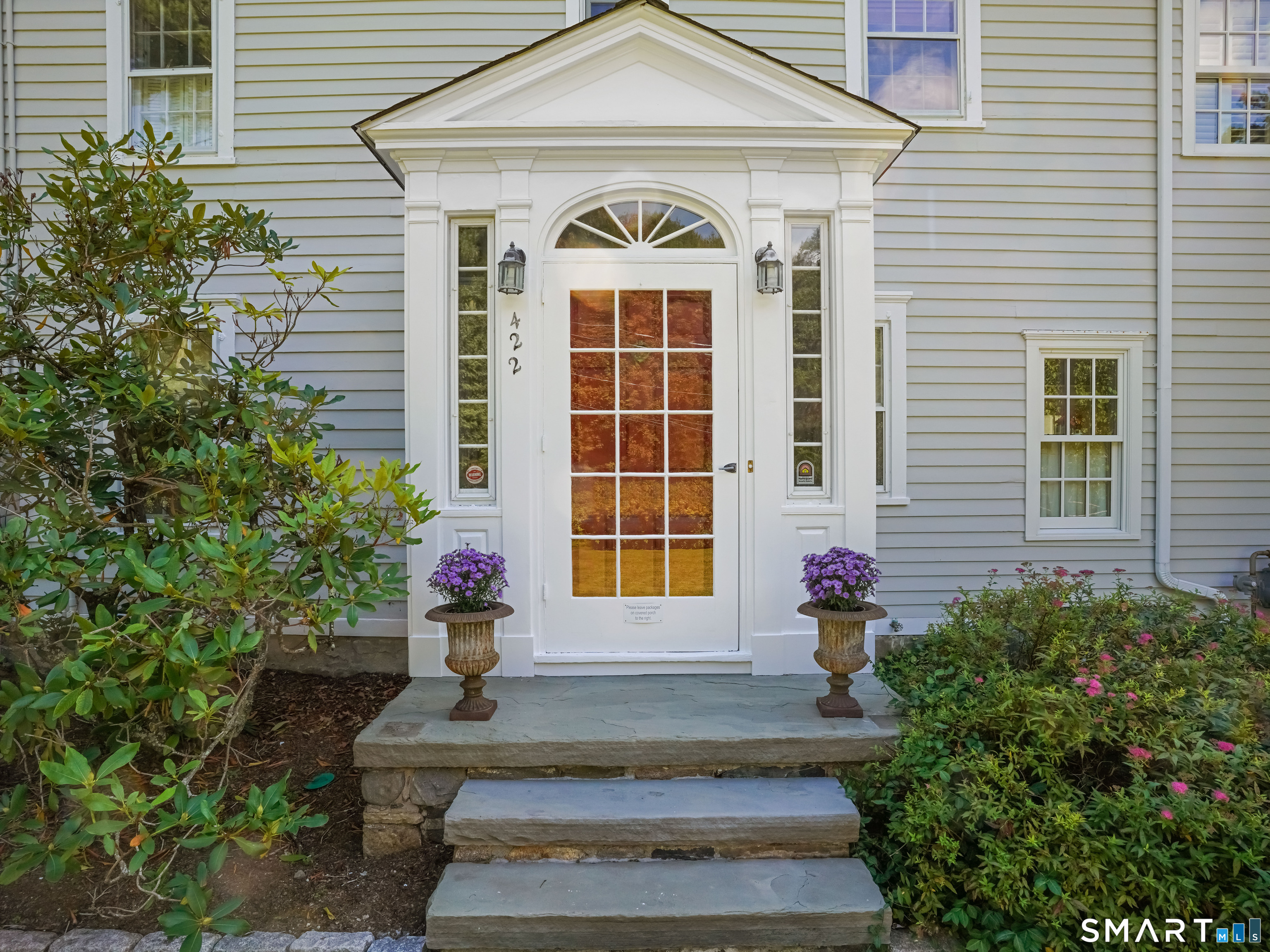 422 Scofieldtown Road Stamford, CT 06903 - Photo 4 of 38 a front view of a house with a yard