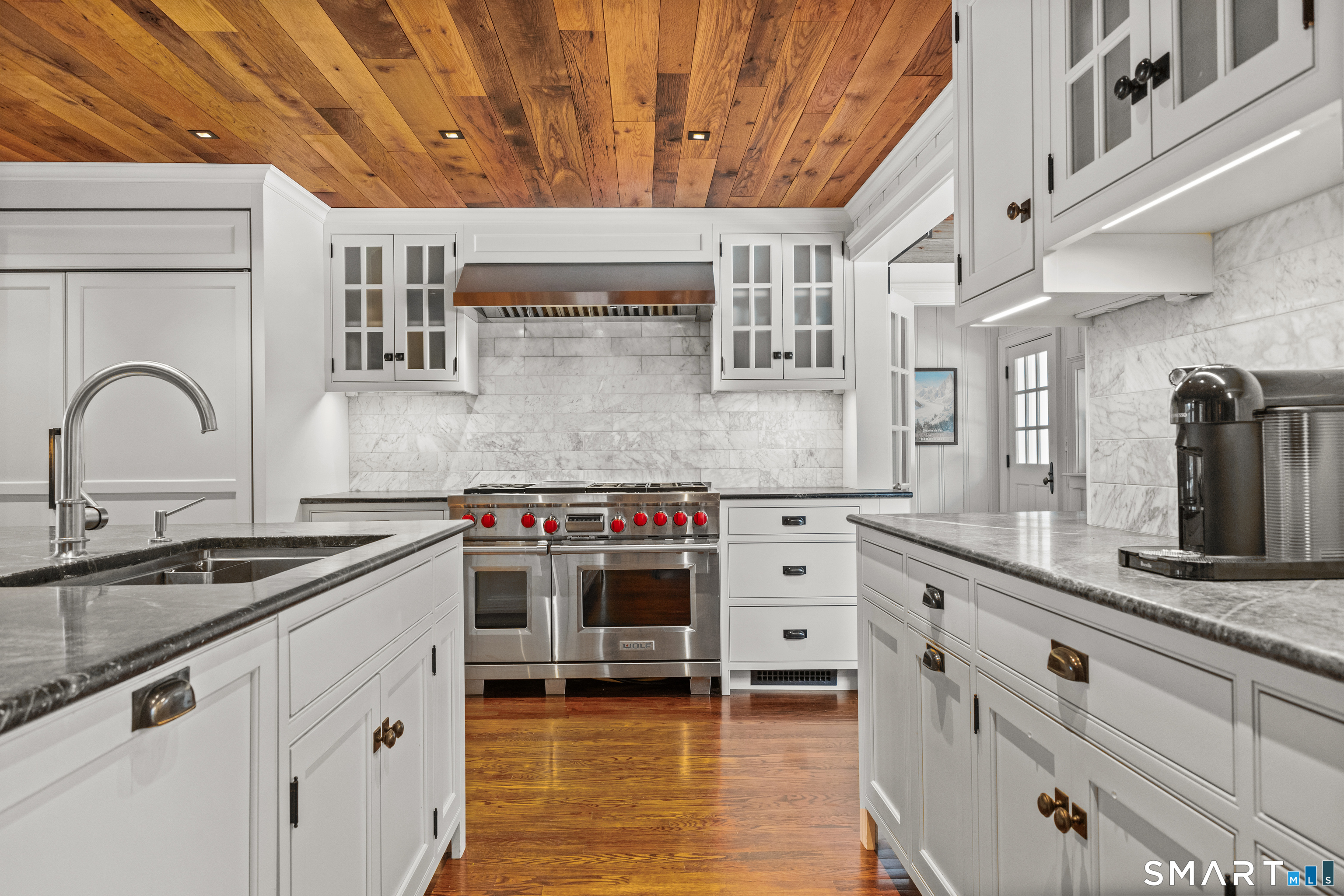 422 Scofieldtown Road Stamford, CT 06903 - Photo 6 of 38 a kitchen with stainless steel appliances granite countertop a stove and a sink
