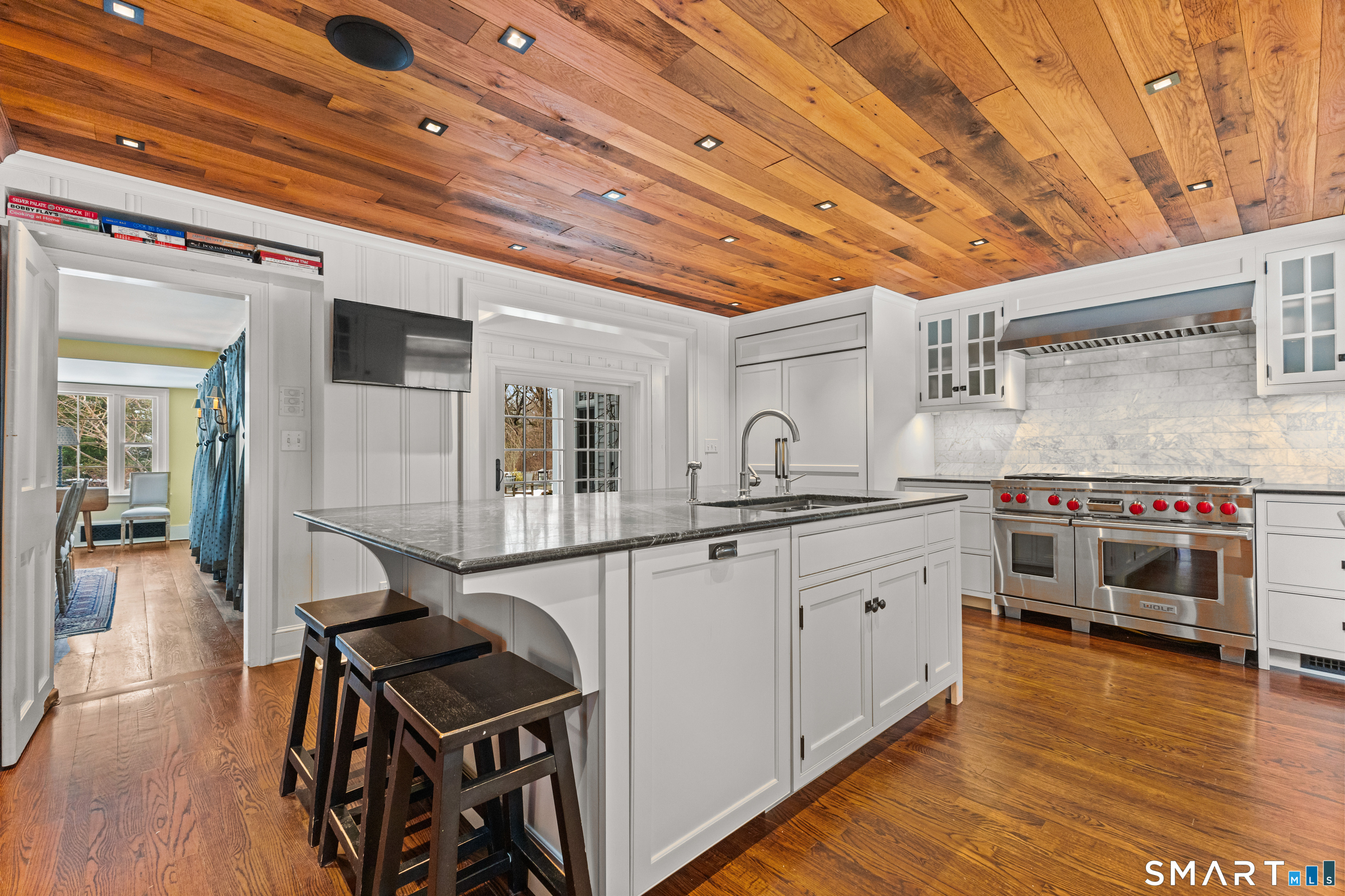 422 Scofieldtown Road Stamford, CT 06903 - Photo 7 of 38 a kitchen with stainless steel appliances granite countertop a stove and cabinets