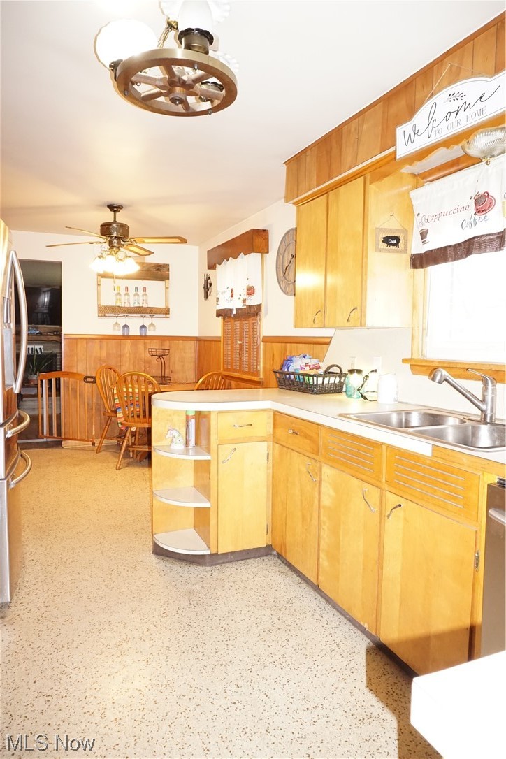 4611 8th Street Northwest Canton, OH 44708 - Photo 9 of 29 Kitchen featuring ceiling fan with notable chandelier, fridge, dishwasher, and sink