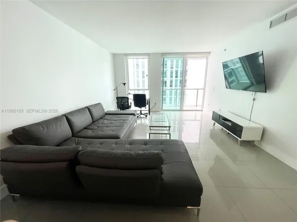 a kitchen with a sink a stove top oven and cabinets