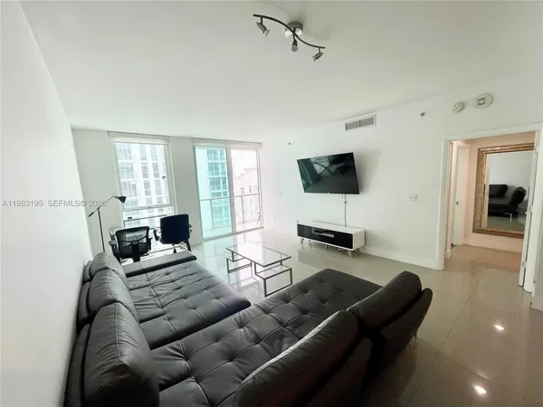 a kitchen with stainless steel appliances granite countertop a sink a stove and a microwave oven