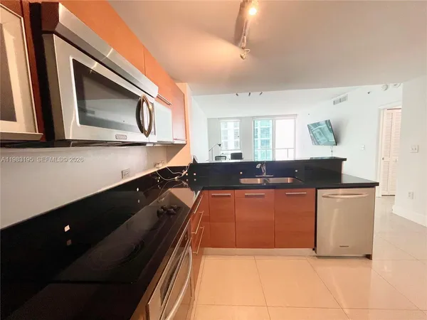 a view of a hallway with a living room