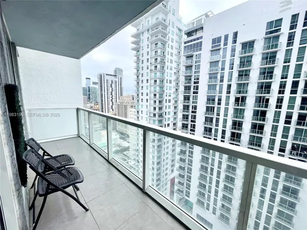 a view of living room with furniture and a rug