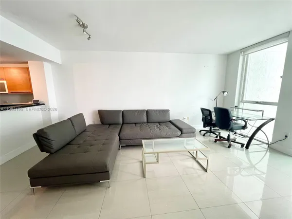 a kitchen with stainless steel appliances a refrigerator and a stove