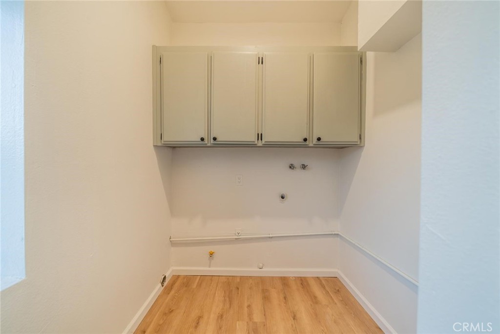 16754 Pauhaska Road Apple Valley, CA 92307 - Photo 16 of 19 a view of a room with wooden floor