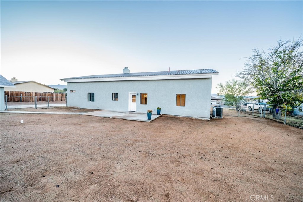 16754 Pauhaska Road Apple Valley, CA 92307 - Photo 18 of 19 a view of house with backyard and deck