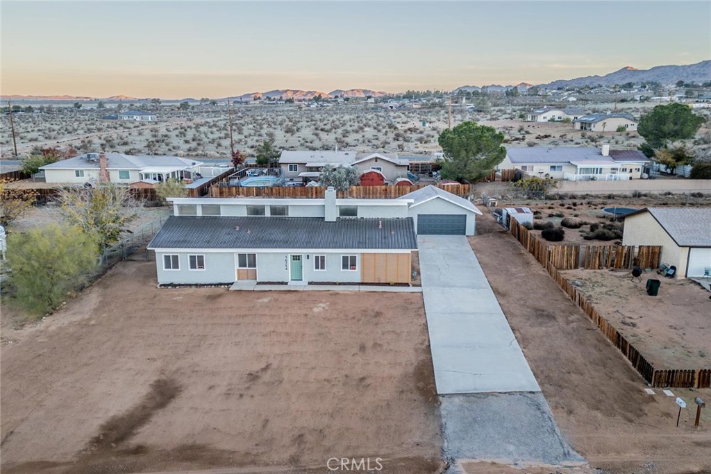 16754 Pauhaska Road Apple Valley, CA 92307 - Photo 2 of 19 an aerial view of residential houses with outdoor space