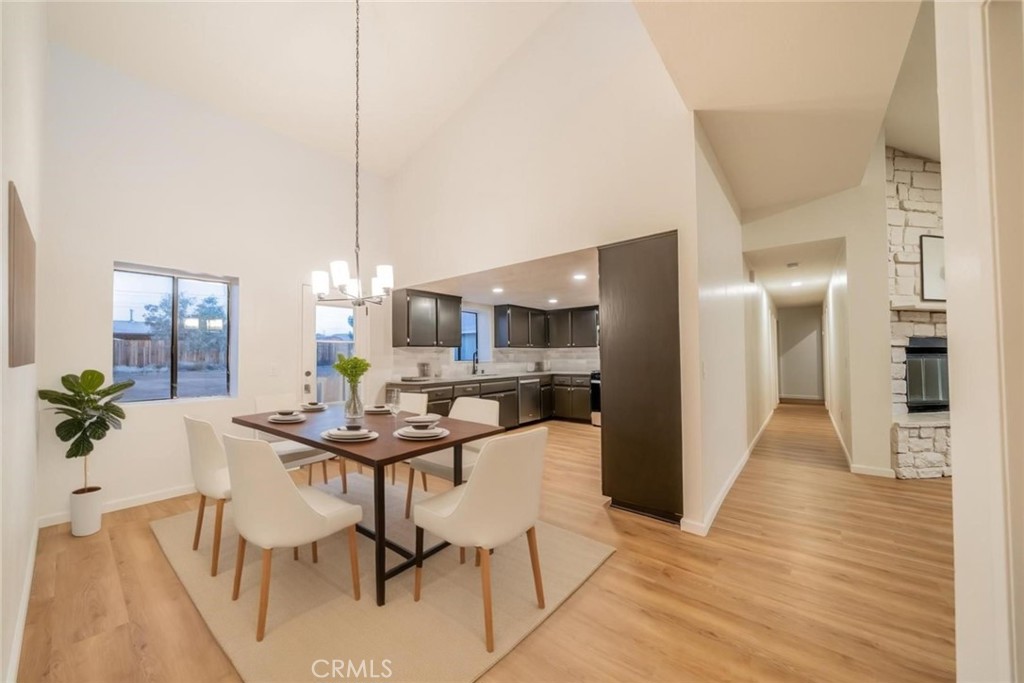 16754 Pauhaska Road Apple Valley, CA 92307 - Photo 6 of 19 a dining room with furniture and wooden floor