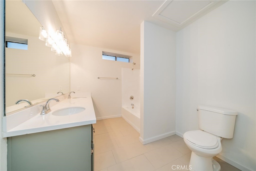 16754 Pauhaska Road Apple Valley, CA 92307 - Photo 10 of 19 a bathroom with a sink toilet and vanity