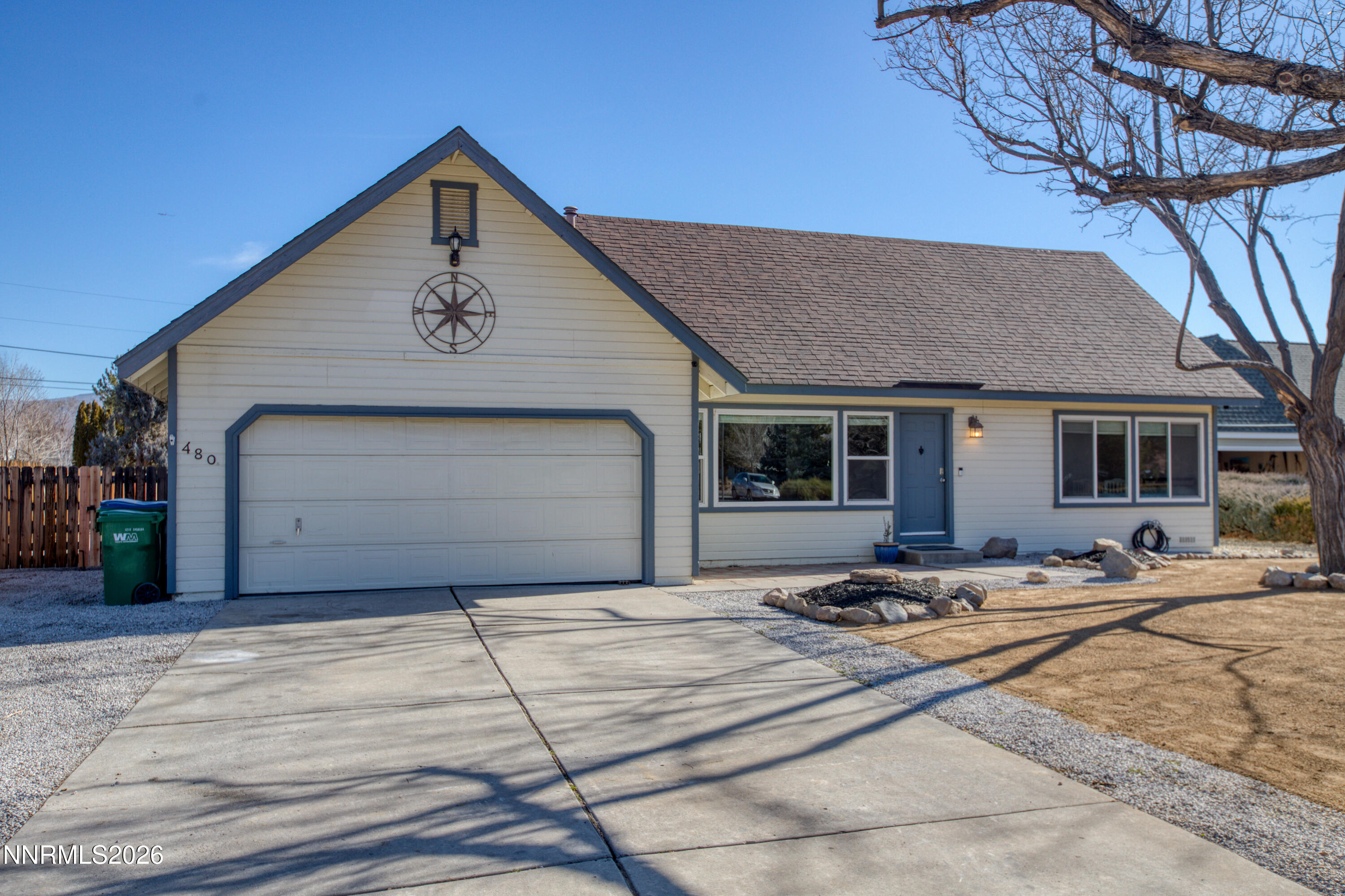 a front view of a house with garage