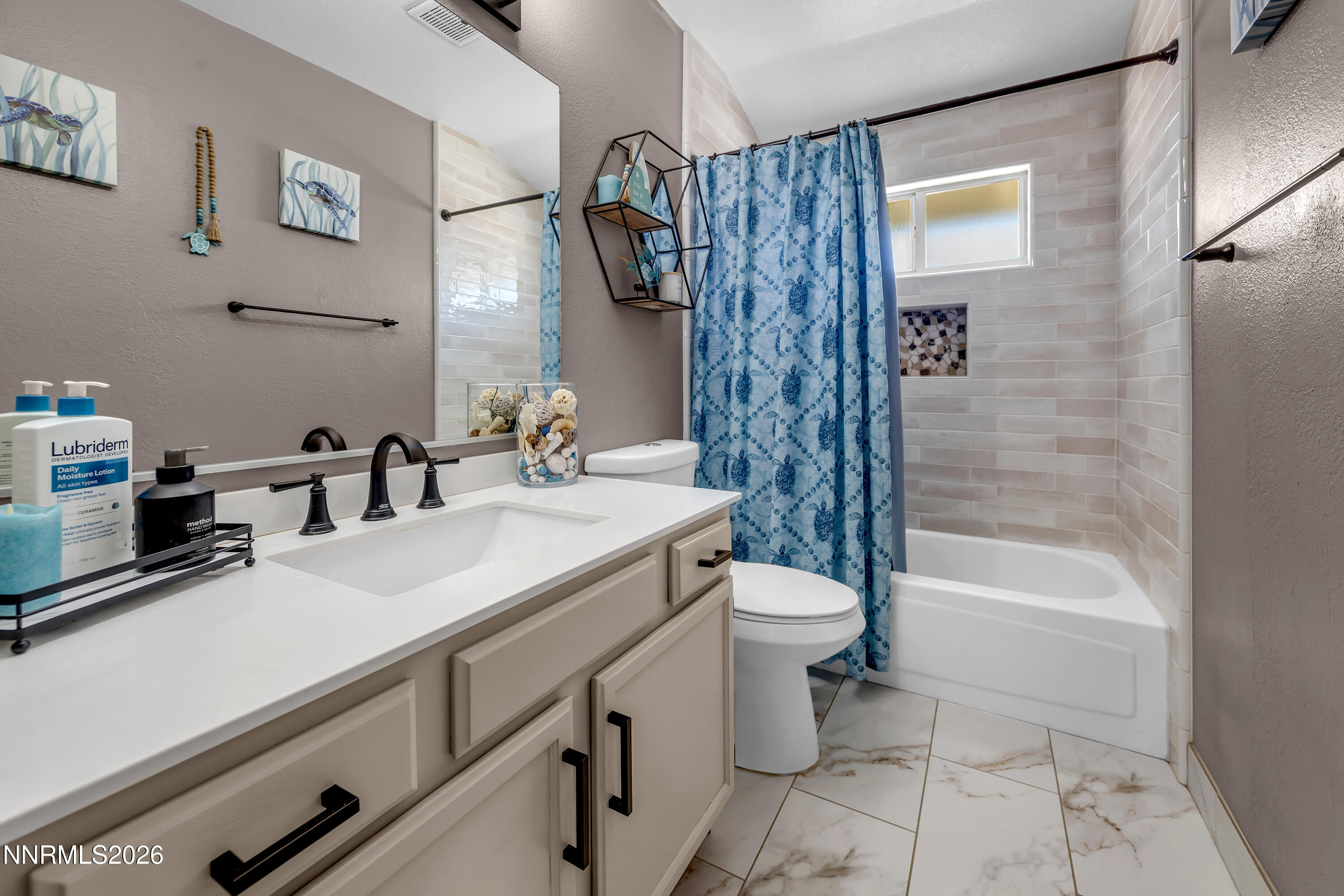 480 Aswan Street Sparks, NV 89441 - Photo 11 of 41 a bathroom with a sink a toilet and a bathtub