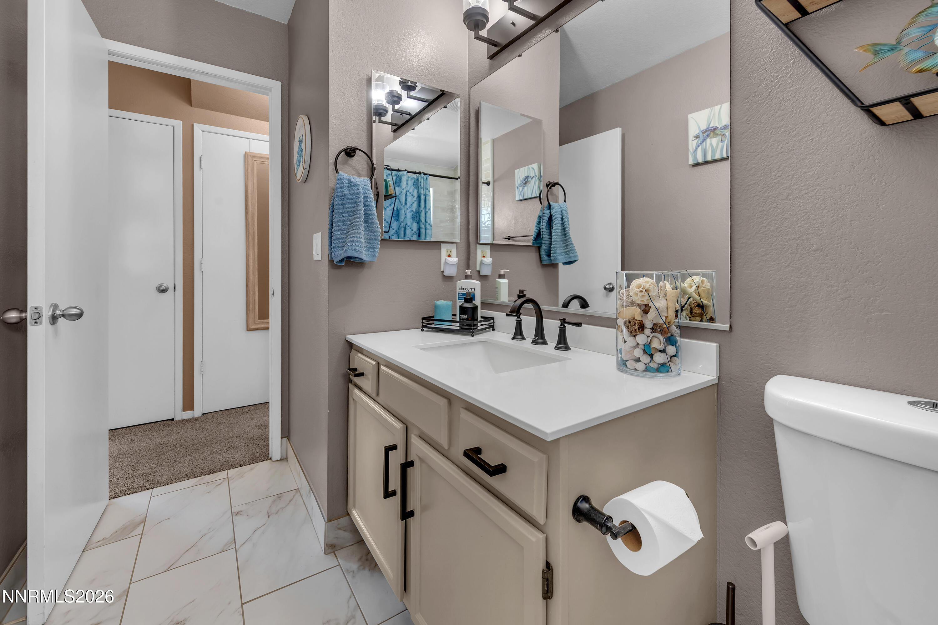 480 Aswan Street Sparks, NV 89441 - Photo 12 of 41 a bathroom with a sink and a mirror