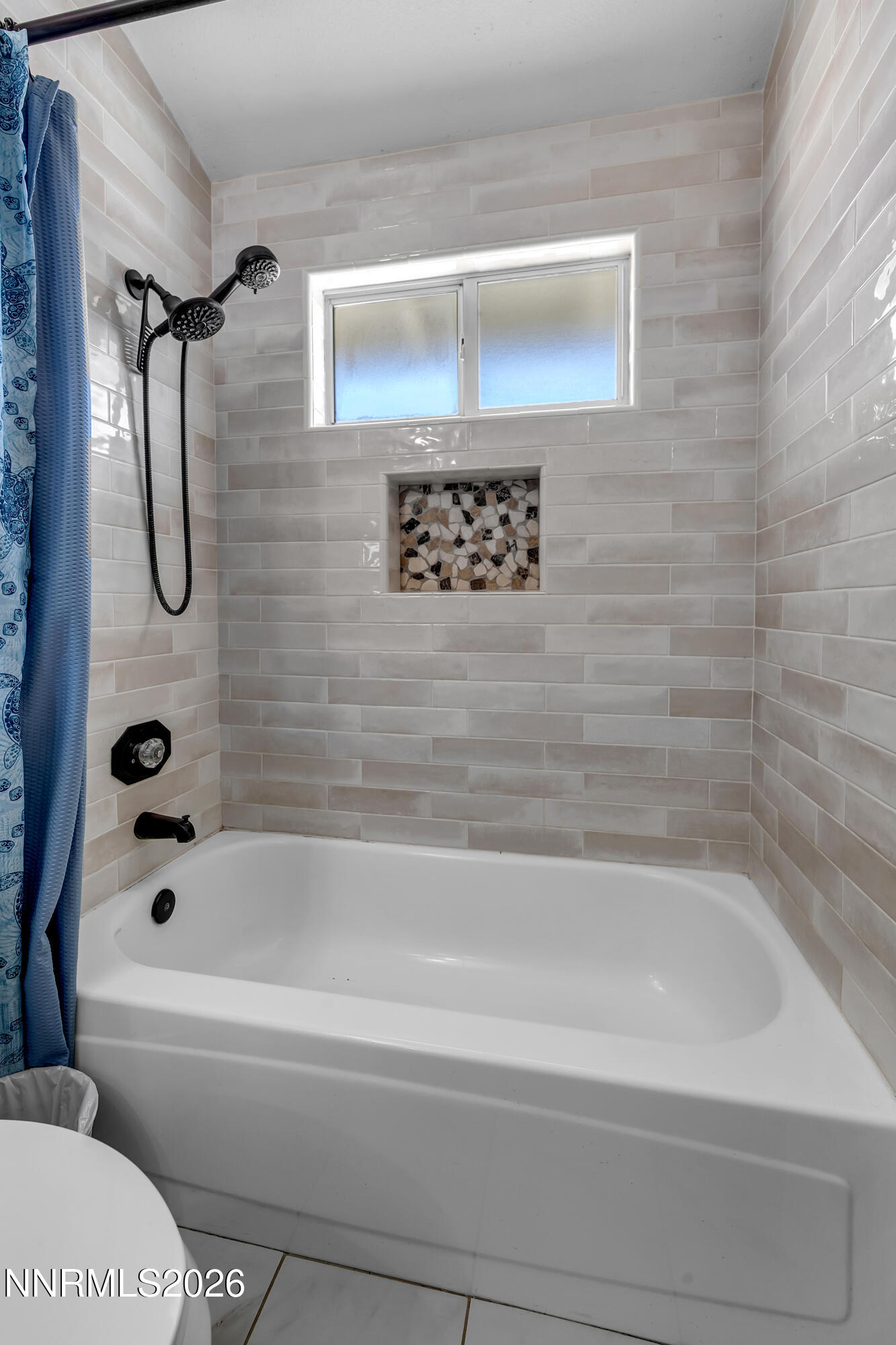 480 Aswan Street Sparks, NV 89441 - Photo 13 of 41 a bathroom with a shower and a bath tub