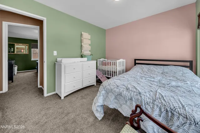 a bedroom with a bed and a cabinets