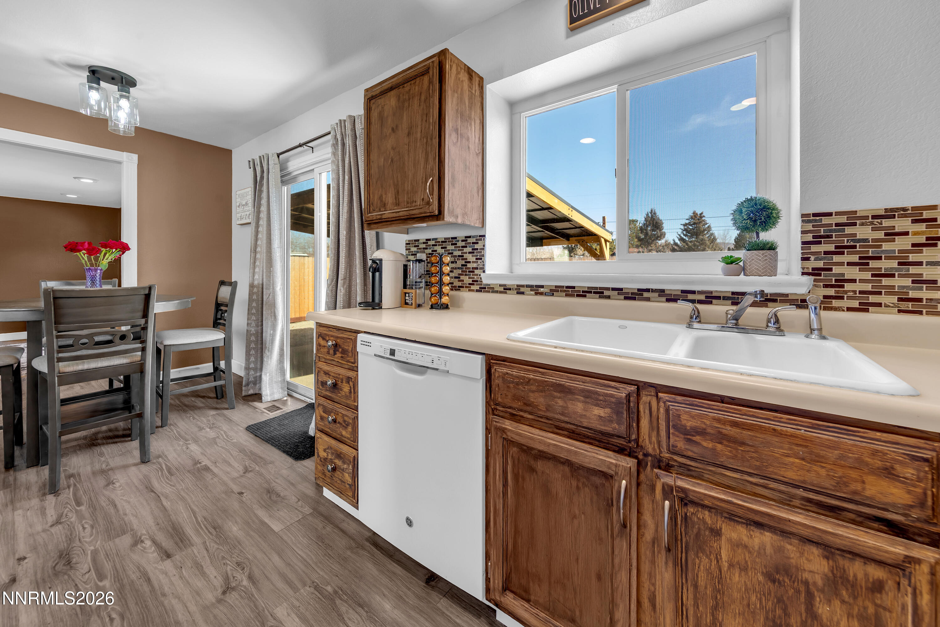 480 Aswan Street Sparks, NV 89441 - Photo 21 of 41 a kitchen with wooden cabinets and a sink