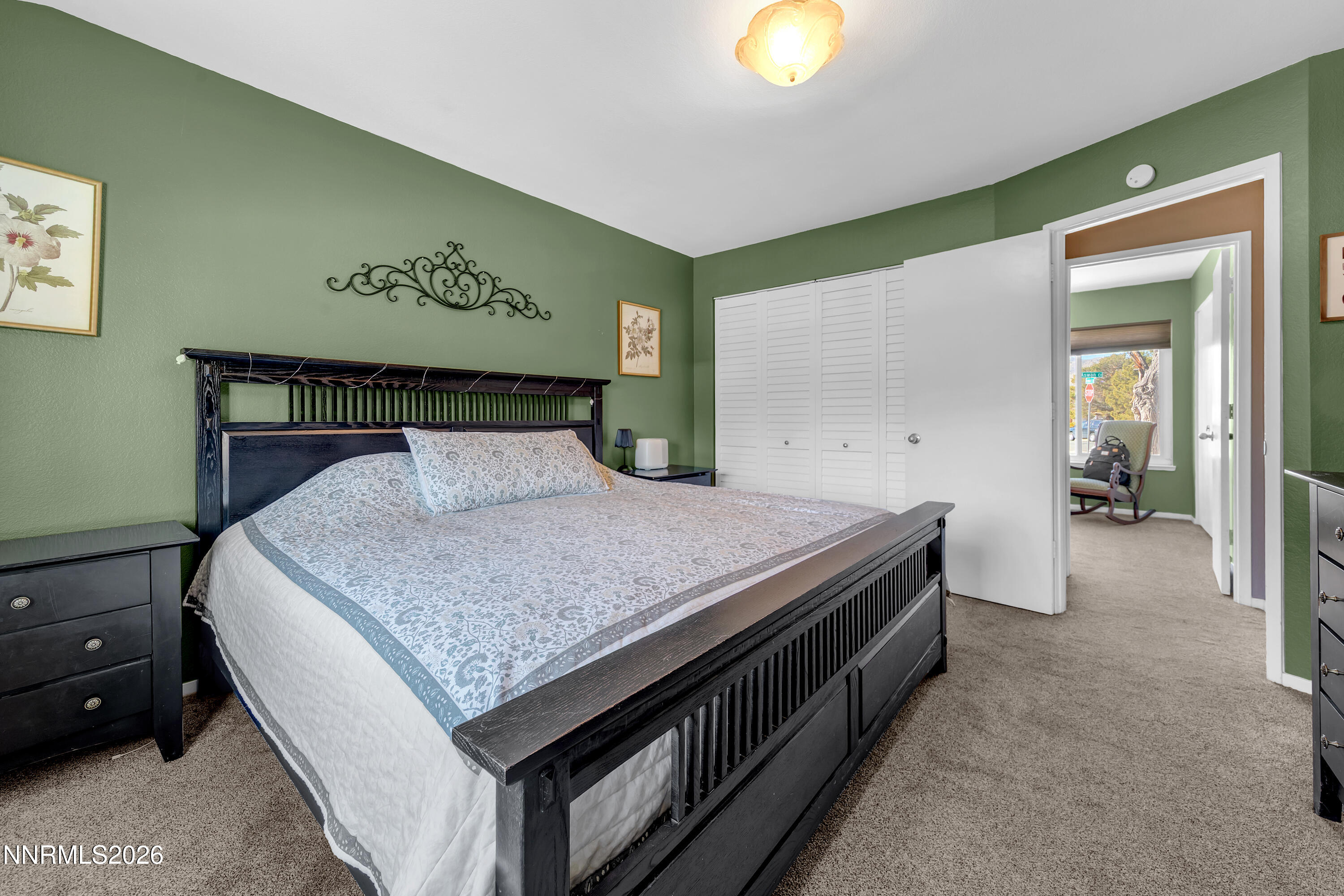 480 Aswan Street Sparks, NV 89441 - Photo 10 of 41 a spacious bedroom with a bed and painting on the wall