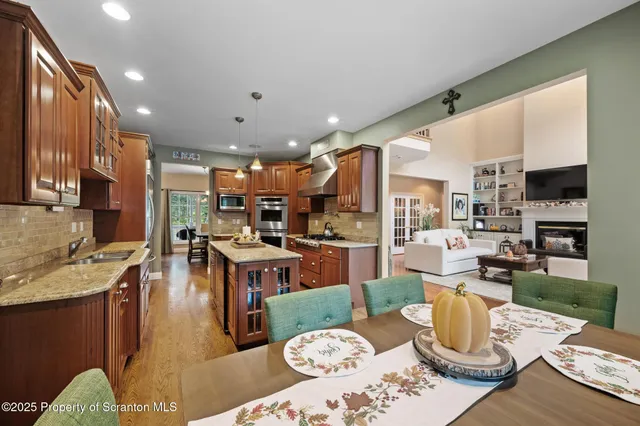 a bedroom with a large bed and a flat screen tv