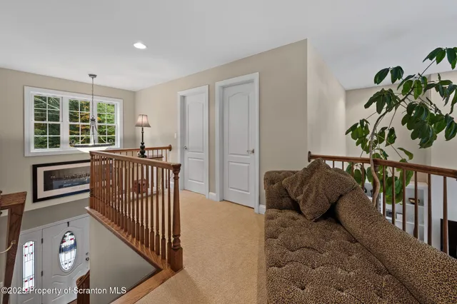 a bedroom with a bed and a large mirror