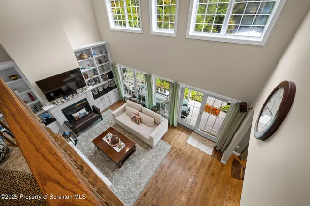 a bathroom with a granite countertop toilet sink and mirror