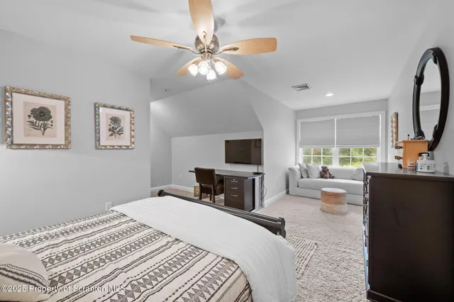 a bathroom with a shower and a sink