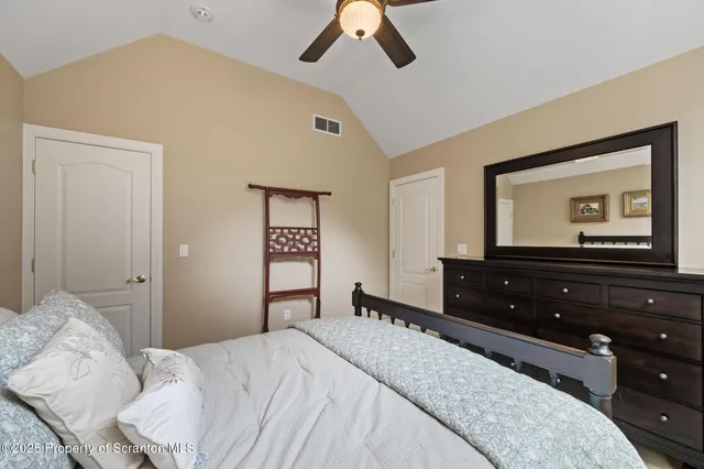 a swimming pool with trees in front of it