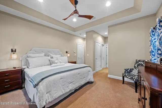 a aerial view of a house with a big yard and large trees