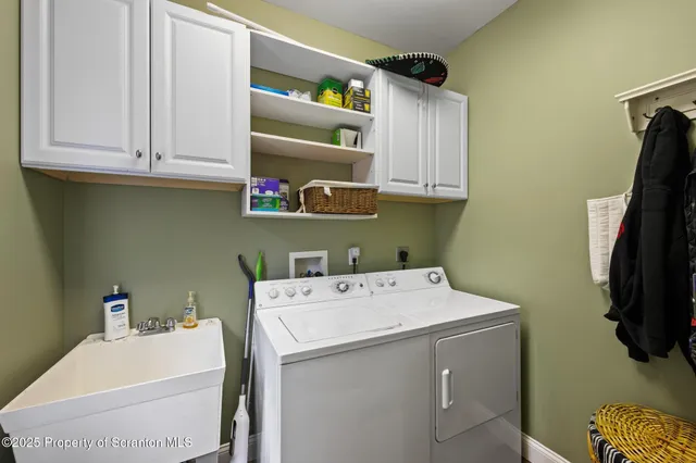 a balcony with furniture and a potted plant