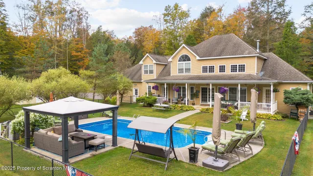 a view of a brick house with potted plants