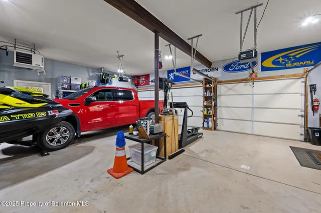 a view of a chairs and fire pit in the backyard