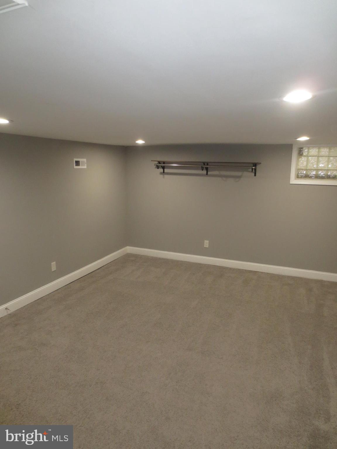 2027 Ramblewood Road Baltimore, MD 21239 - Photo 12 of 17 a view of a room with racks on the wall