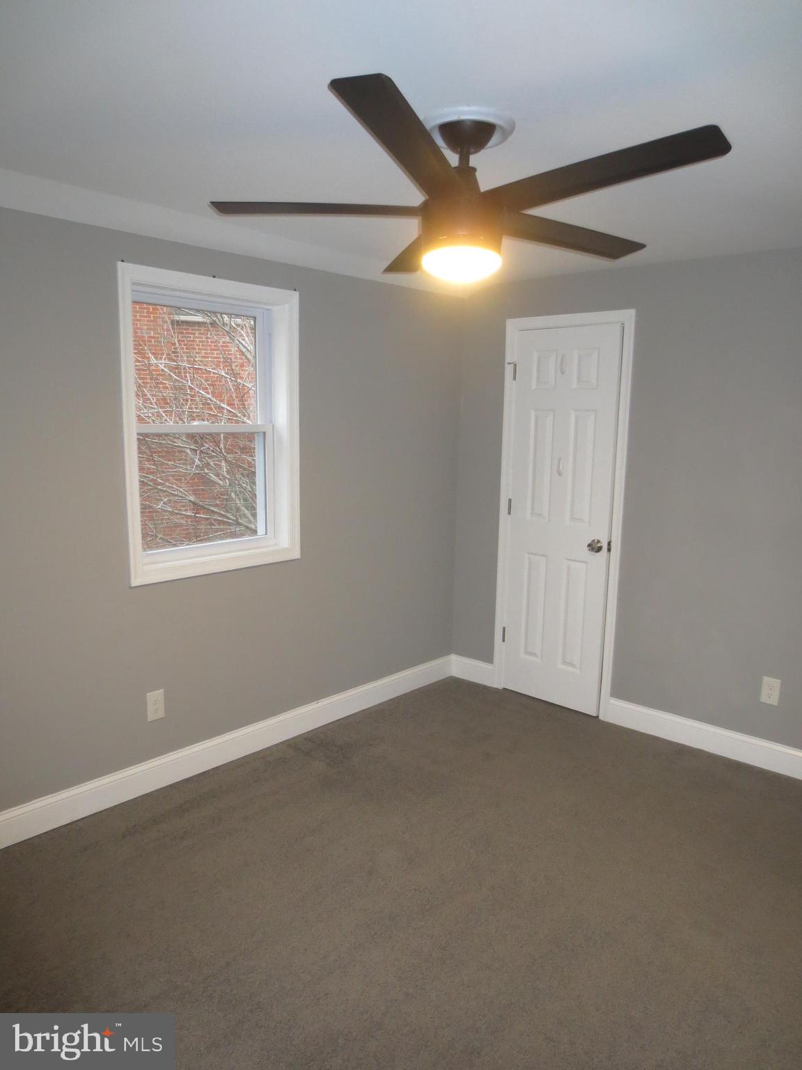 2027 Ramblewood Road Baltimore, MD 21239 - Photo 9 of 17 a view of an empty room with a window