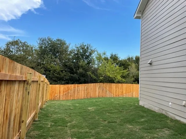 a view of kitchen with microwave cabinets and stove top oven