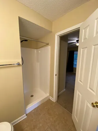 a bathroom with a sink a toilet and bathtub